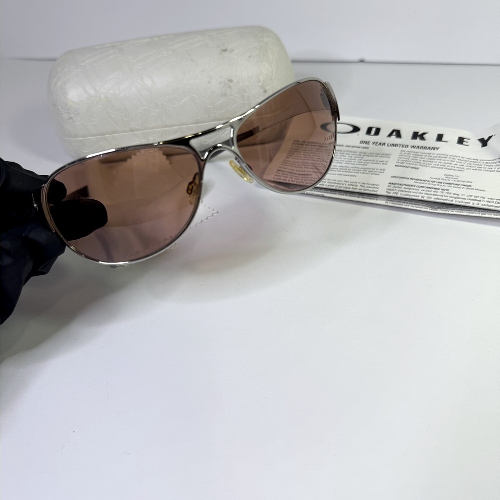 Oakley Silver Sunglasses with Pink Tint Lenses